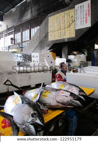 TOKYO - MARCH 23: Seafood merchant sell fish and seafood in Tsukiji fish market. It is the biggest wholesale seafood market in Japan March 23,2012 in Tokyo, Japan.