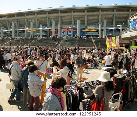 YOKOHAMA,JAPAN - NOVEMBER 4: Shoppers come to flea market at Nissan Stadium on November 4,2012. It is the monthly flea market in Shin-Yokohama.