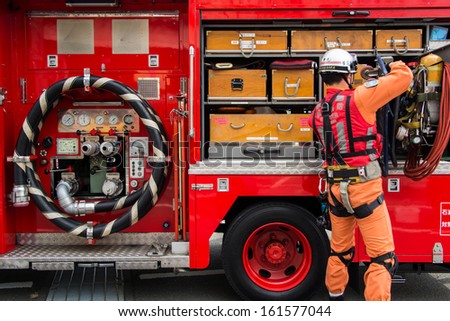 Kanagawa, Japan - January 5: Unidentified Male Firefighter Demonstrates The Rescue Tools At Nissan Stadium On January 5, 2013 In Kanagawa, Japan.