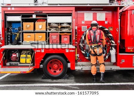 Kanagawa, Japan - January 5: Unidentified male firefighter demonstrates rescue tools in the New Year's Fire Review at Nissan Stadium on January 5, 2013 in Kanagawa, Japan.
