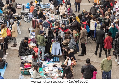 Harajuku, Japan - December 8: Shoppers come to flea market at Yoyogi Park in Harajuku on December 8, 2013. It is the winter flea market in the city of fashion Harajuku, Japan.