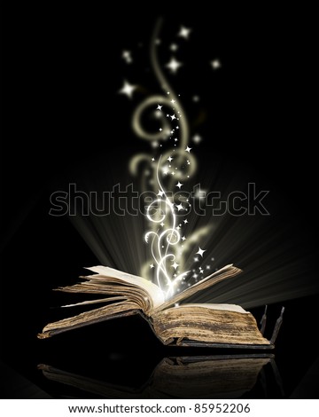 Opened book magic on black