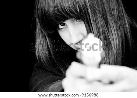 Mad woman aiming at you with a gun.