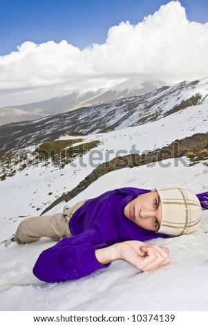 Man in casual clothing relaxed over the snow