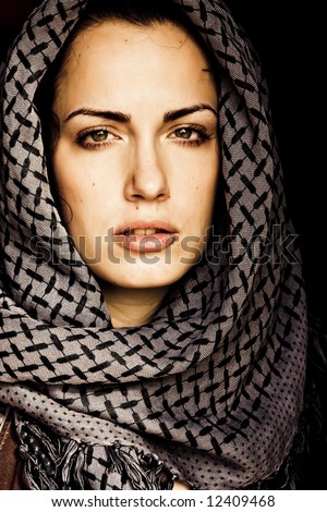 stock photo : Arab woman using veil with her mouth pierced.