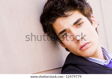 Attractive male model on wall