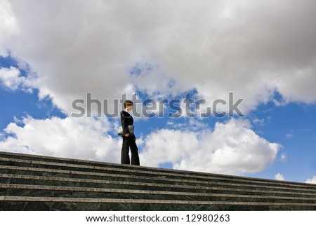 Businesswoman posing against huge cloudscape.