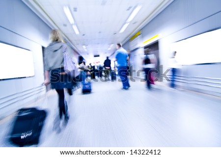 Blurred advancing people through airport installations