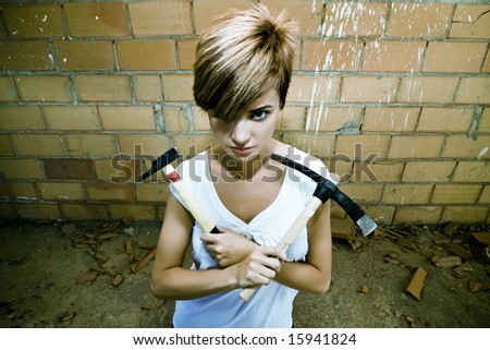 Female laborer posing with her tools in an ancient Egyptian style.
