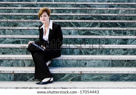 Smiling businessman over marble steps background.