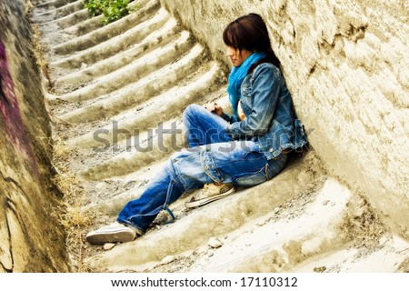 صور فراق الحبيب Stock-photo-young-thoughtful-woman-sitting-on-stone-stairs-17110312