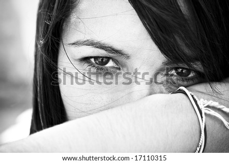 Young staring woman in contrasted black and white.