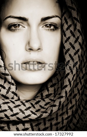 Arab woman using veil with her mouth pierced.