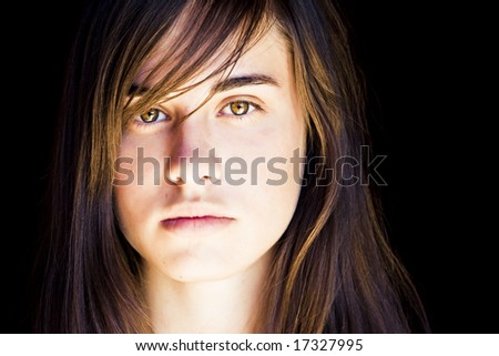 Young beautiful woman portrait with impressive green eyes.