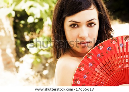 woman behind fan