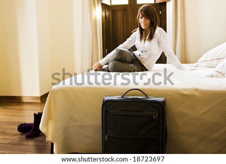 Long haired businesswoman resting in bed.