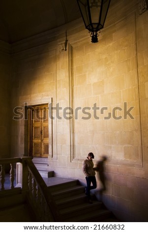 Young woman inside huge castle.