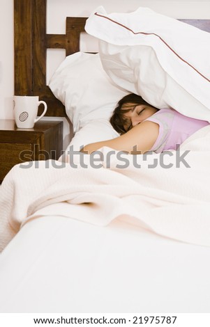 Young sleeping woman near empty cup