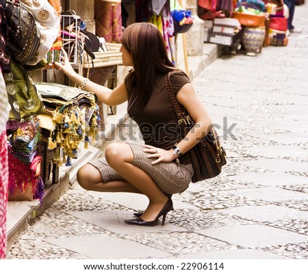 Woman shopping in arab styled market. Squared format.