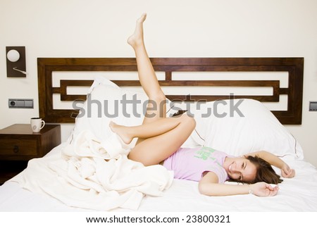 Young beautiful woman enjoying her waking up.