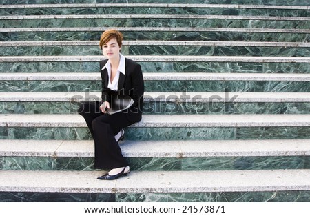 Young businesswoman over marble steps background.