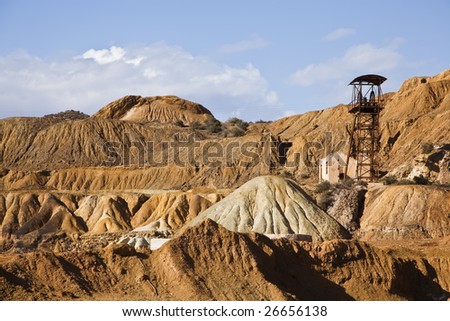 Abandoned old mining machinery in desert.