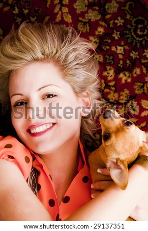 Young blond beauty posing with her pet.
