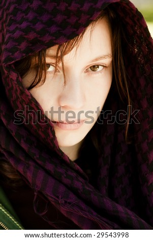 Staring woman portrait covered by veil