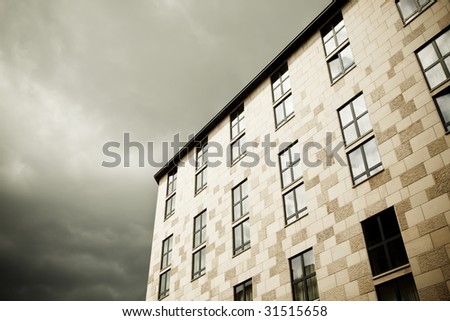 Classic European building facade under cloudscape