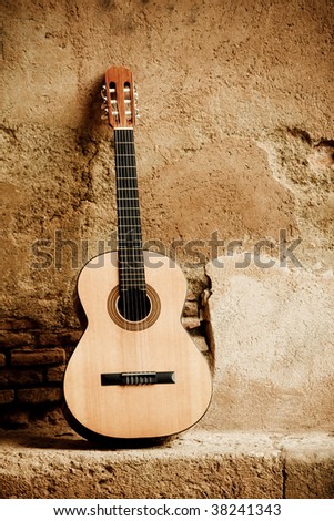 Spanish guitar on old wall