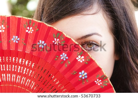 woman behind fan