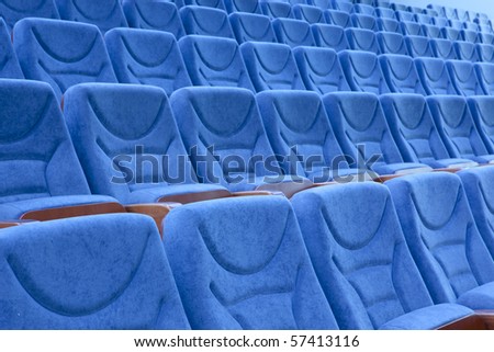 Empty blue chairs at cinema or theater
