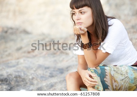Young pensive woman close portrait in pensive gesture.