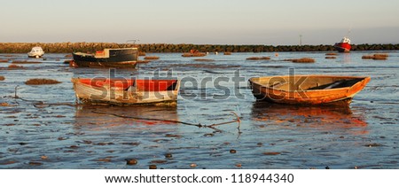Small boats at low tide