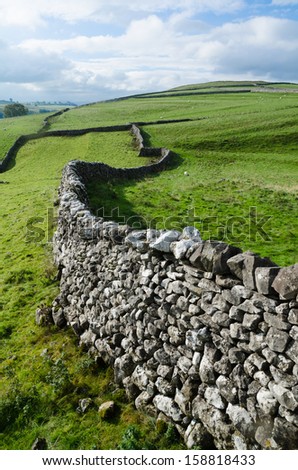 Winding drystone wall across the dales. UK