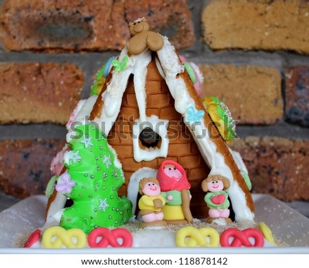 Cute gingerbread house with little people