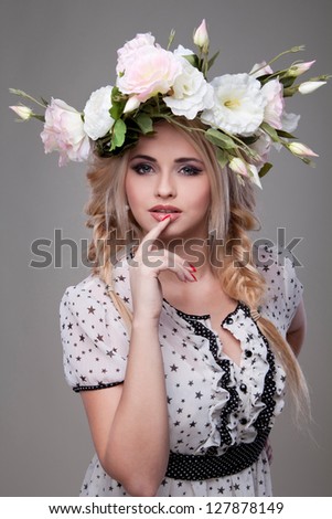 A beautiful girl with flowers in hair with a smile