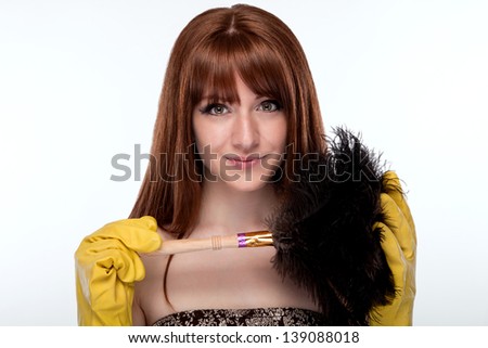 Portrait of a maid in gloves and a dust brush