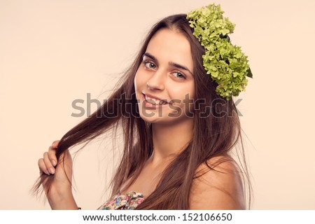 portrait of a girl holding the tip of the hair itself