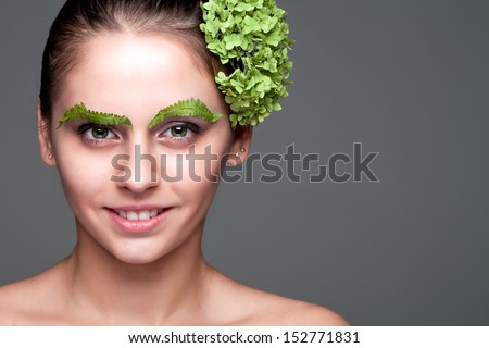 portrait of a girl with a fern on eyebrows