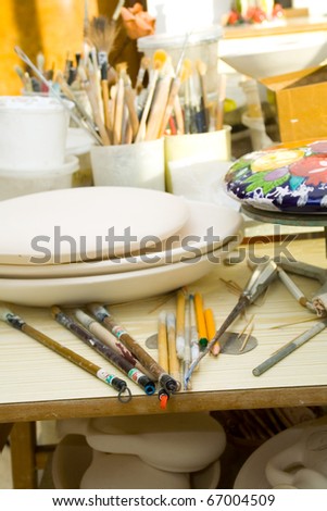 Workplace in the artist\'s studio. Brushes, tools and materials