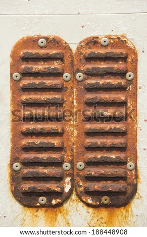 Rusty metal shutters on the inlet power cabinet. Background for graphic design.