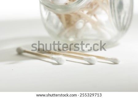 Cotton Swabs with wooden sticks on white background
