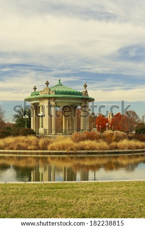 St. Louis Forest Park's Nathan Frank Bandstand in the midst of Pagoda Circle under a sky partly filled with cirrus clouds in autumn.