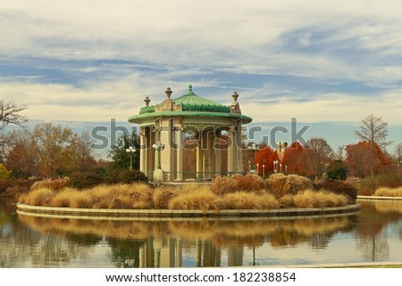St. Louis Forest Park\'s Nathan Frank Bandstand in the midst of Pagoda Circle under a sky partly filled with cirrus clouds in autumn.