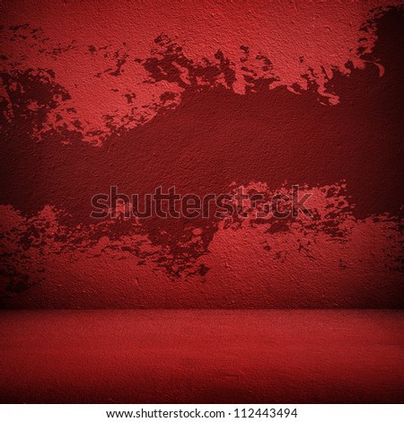splash of paint on the red wall