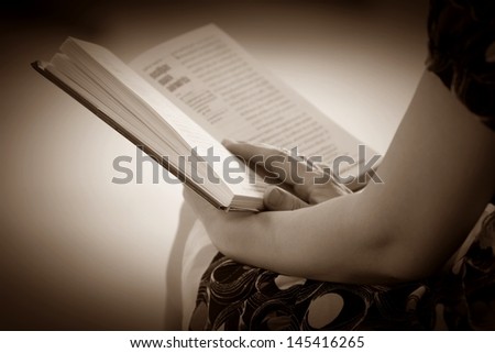 Women hand open book for reading, concept background