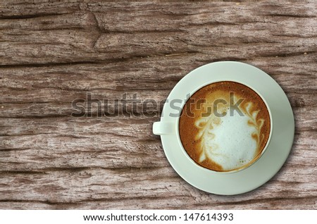 Top view of coffee cup on old table, bird eye view of coffee cup
