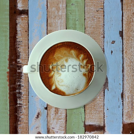 bird eye view of coffee cup on old table