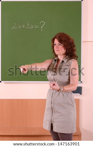Teacher pointing the student and call the board